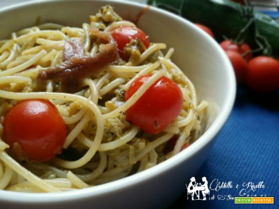 Spaghetti con alici zucchine e pomodorino