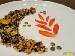 Quinoa tricolore con caponatina di melanzane, zucchine e peperoni condita con olio aromatizzato al basilico
