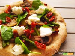 Pizza con pomodori secchi, spinaci, asparagi e spuma di burrata
